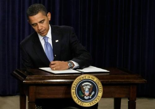 obama-signing-alone.preview