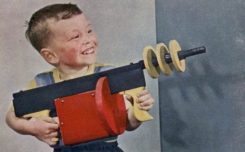 kid with toy gun